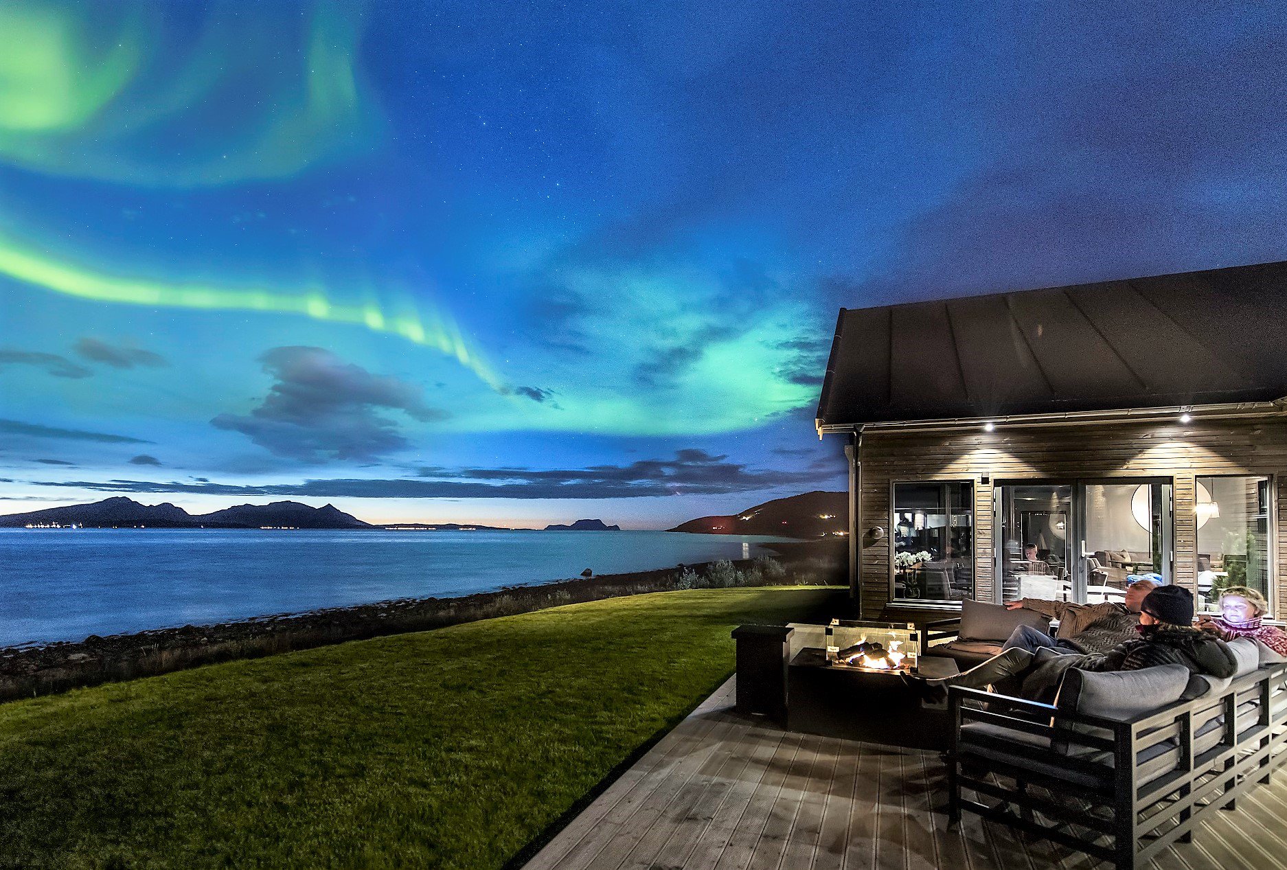Lyngen Experience Lodge under the northern lights in winter, Norway
