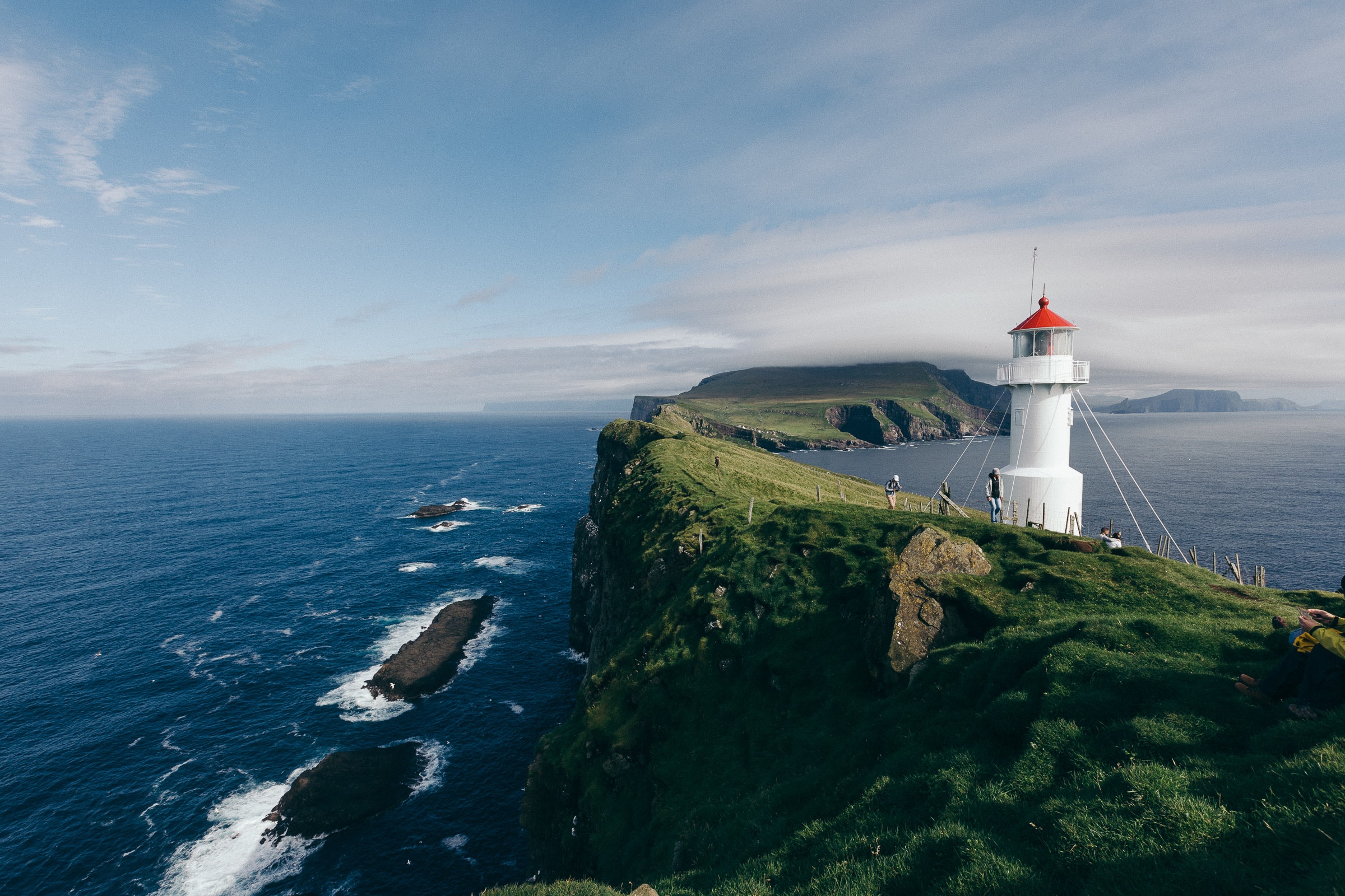 Lighthouse on the faroe islands on a cliff