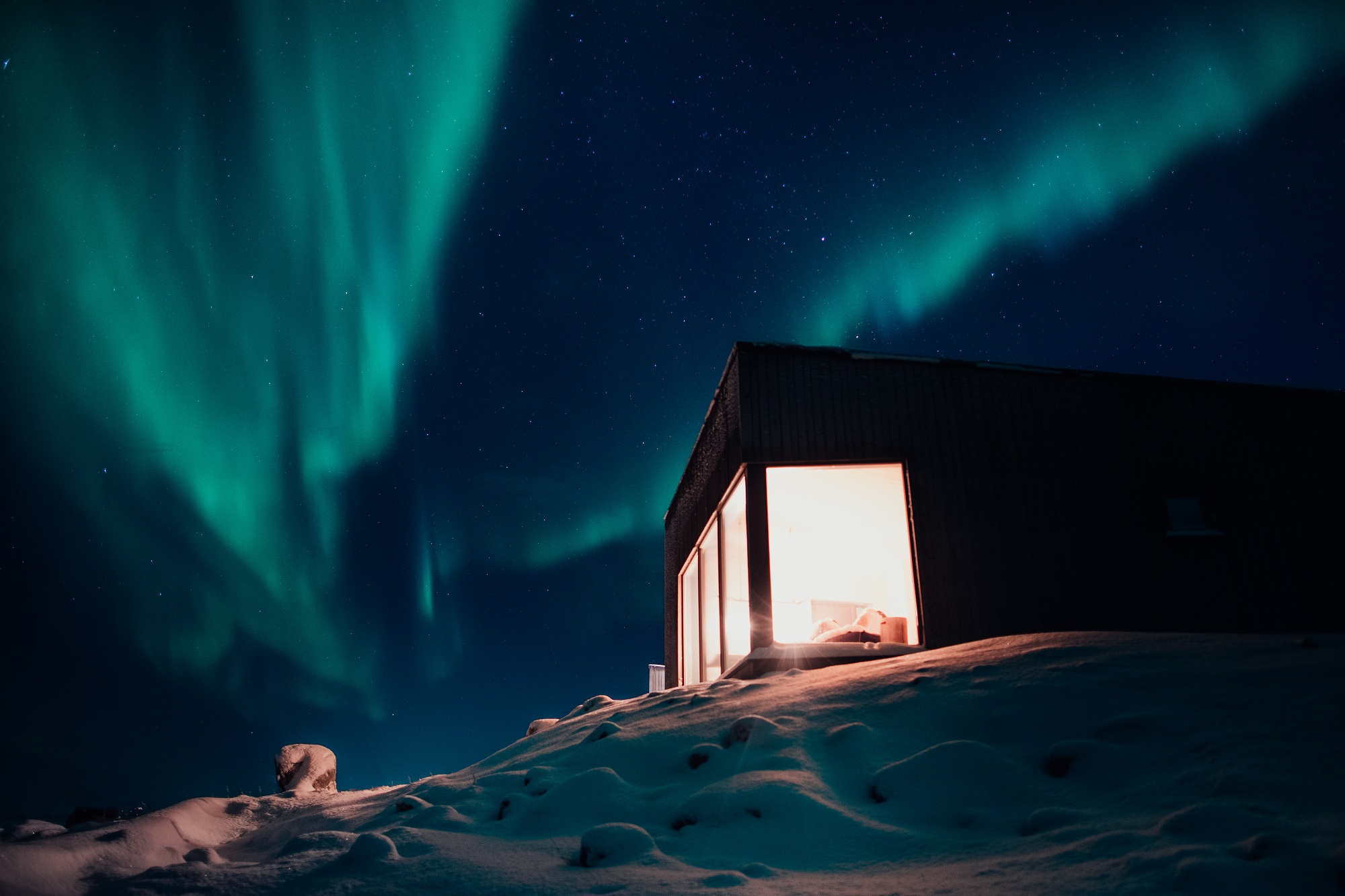 Exterior view of Varanger Lodge under the Northern Lights, Nesseby, Norway